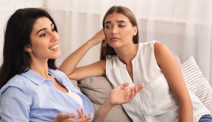 woman, women friendship, annoying friend, annoyed woman, women on couch