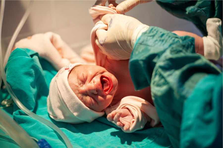 c-section; self-inflicted c-section; woman does own c-section; childbirth; delivering baby; emergency c-section