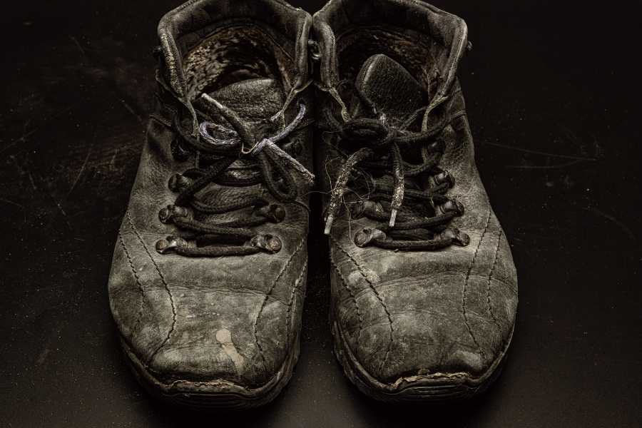 work shoes, tattered shoes, worn shoes, compassion, kind boss