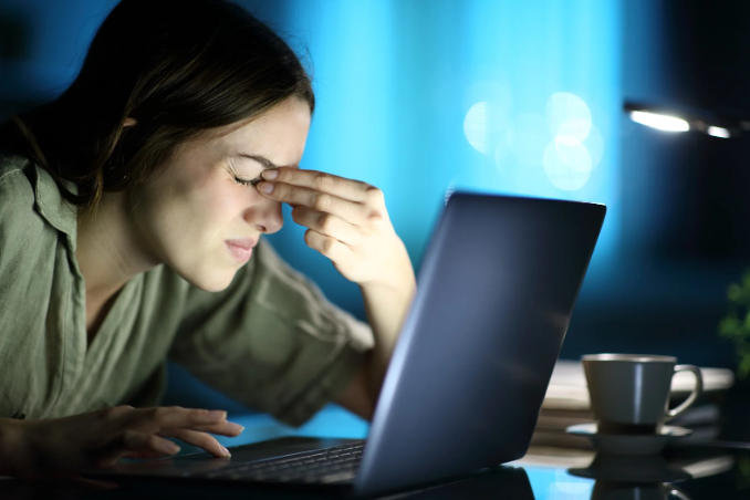 commenter, laptop, disgusted woman, night computer, woman touching her nose