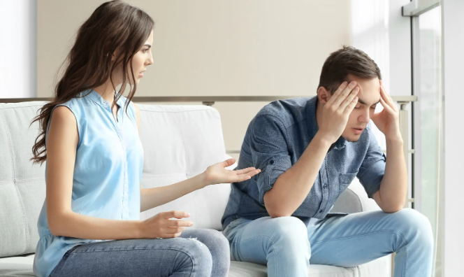 man and woman, couple argument, upset man, upset woman, man woman couch
