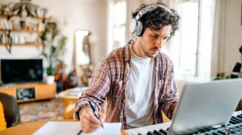 music, husband, man writing song, headphones, keyboard, piano