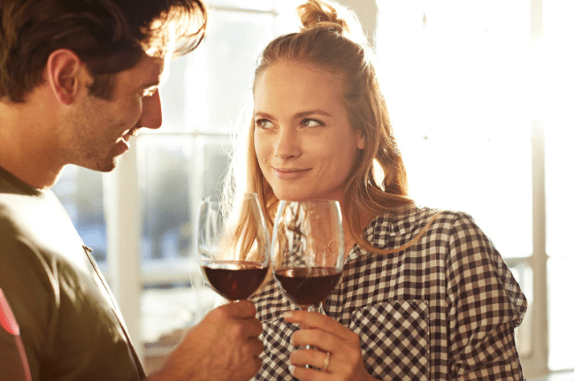 wine, couple, eye contact, blonde lady, smiling woman, starting into eyes