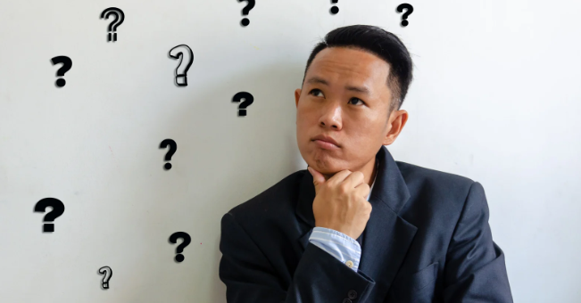 questions, man holding chin, what to ask, asking, conversation, man in suit