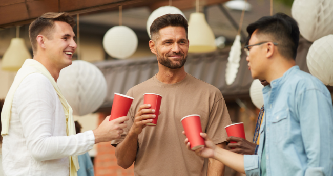 guys with red cups, men having drinks, men joking, party, party conversation, 