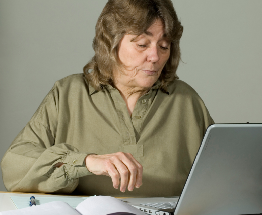 boomer woman, older woman, woman on computer, laptop, sending email