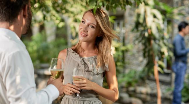 wine, blonde woman, nicely dressed woman, good conversation, eye contact