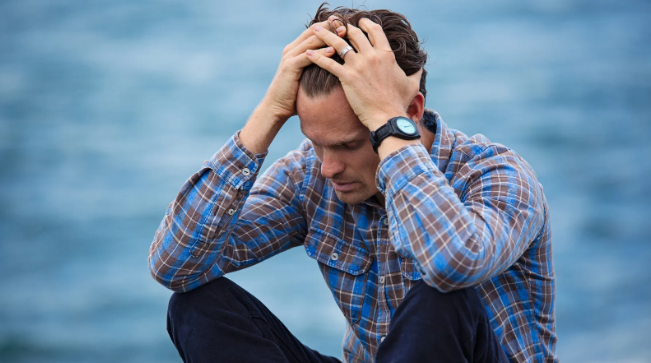 upset man, sad man, man in his 30s, man by ocean, anxiety, depression