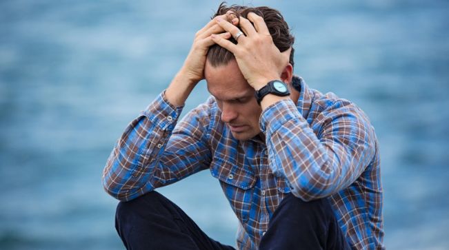 upset man, sad man, man in his 30s, man by ocean, anxiety, depression