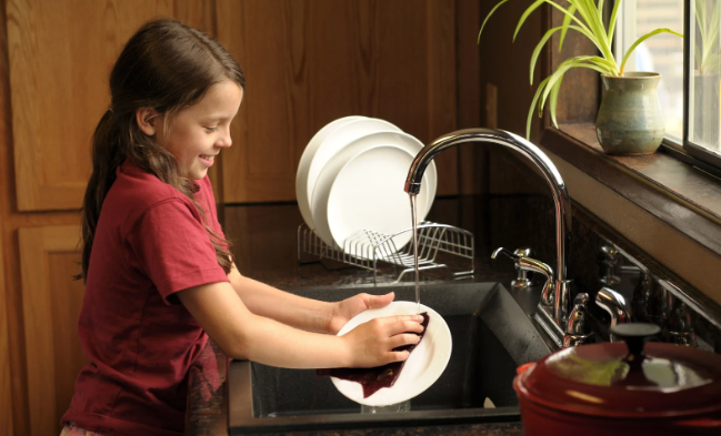 child doing dishes, girl doing dishes, child in kitchen, child doing chores