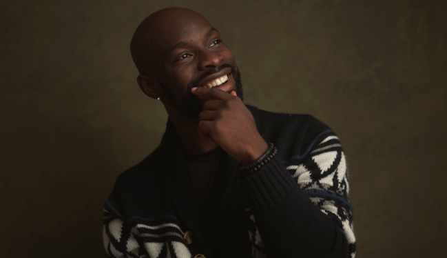 smailing man, ahppy man, good-looking man, man in sweater, man holding chin