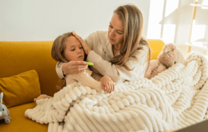 sick child, mom and daughter, illness, sad mom, blanket