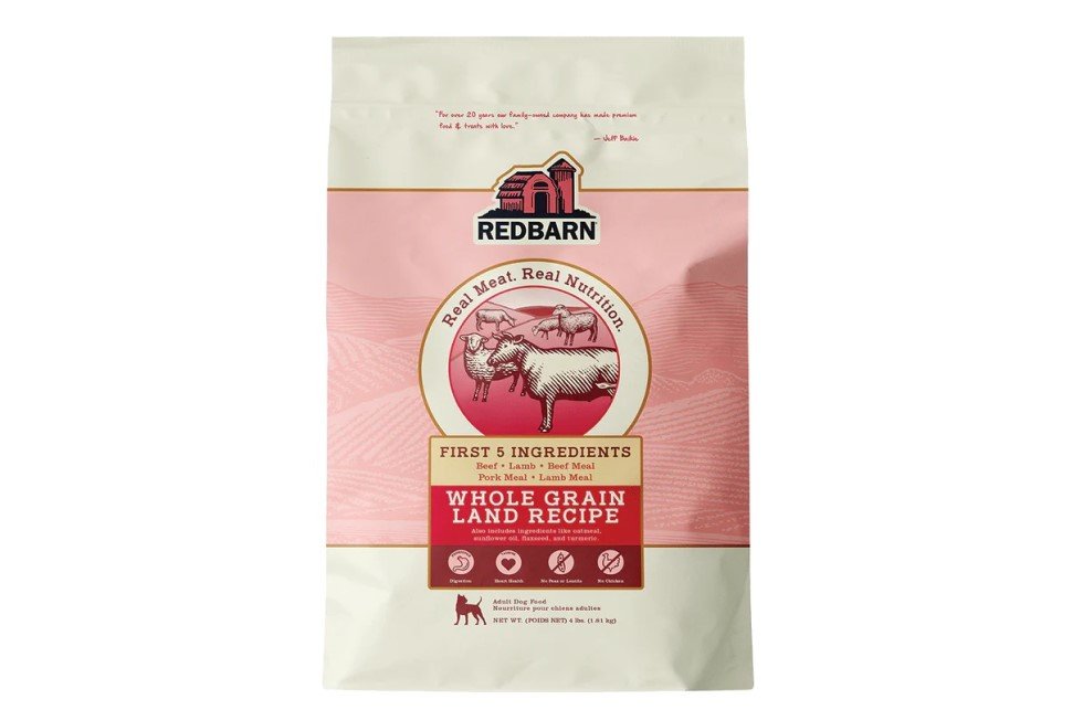 Redbarn Whole Grain Land Recipe dog food bag, pink design with farm animal illustrations.