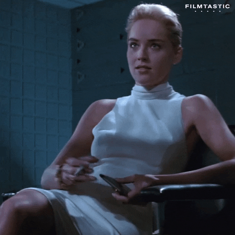 Gif of woman in white dress smoking a cigarette