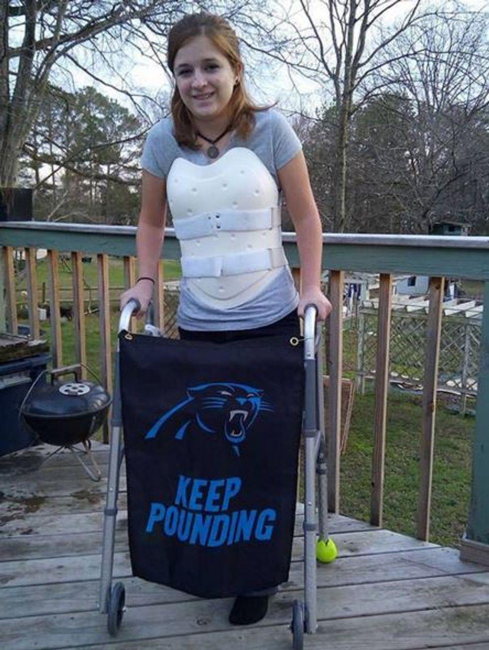 teenage girl wearing a back brace