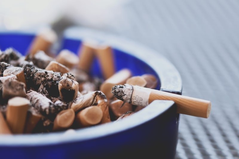 ash tray full of cigarette butts