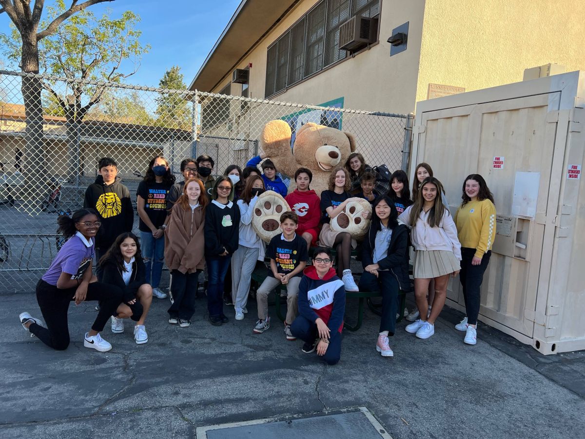 School children pose with Costco Teddy Bear