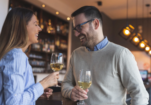 conversation, couple talking, white wine, laughing man, laughing woman,