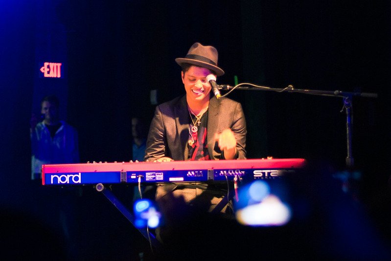 Bruno Mars playing a keyboard