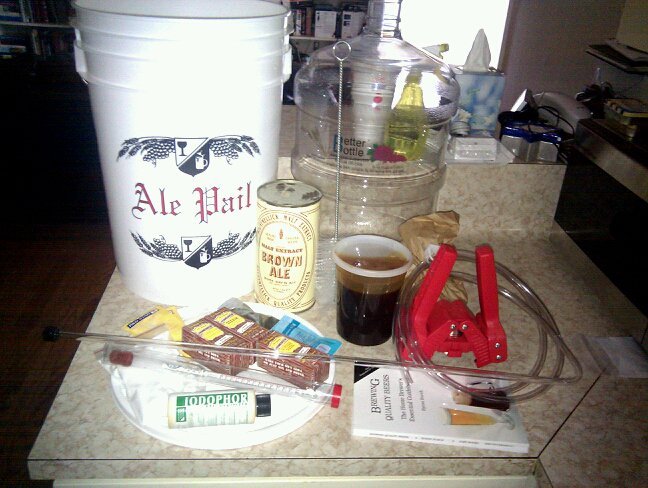Counter full of supplies to make home-brew beer