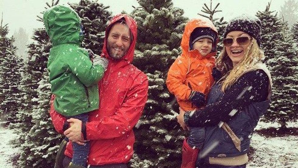 Young family takes photo in the snow