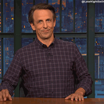 Gif of Seth Meyers tapping his head