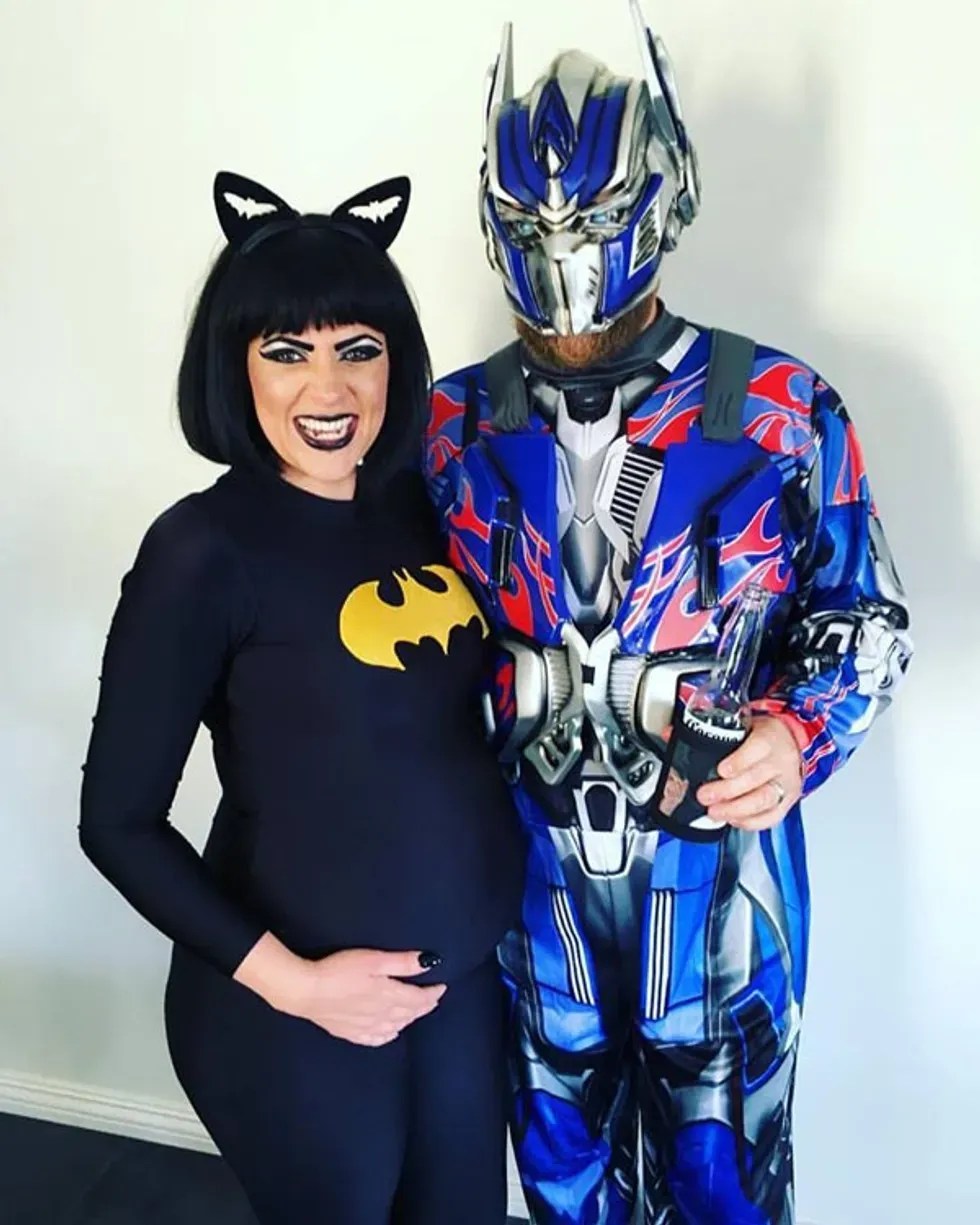 couple posing in costumes