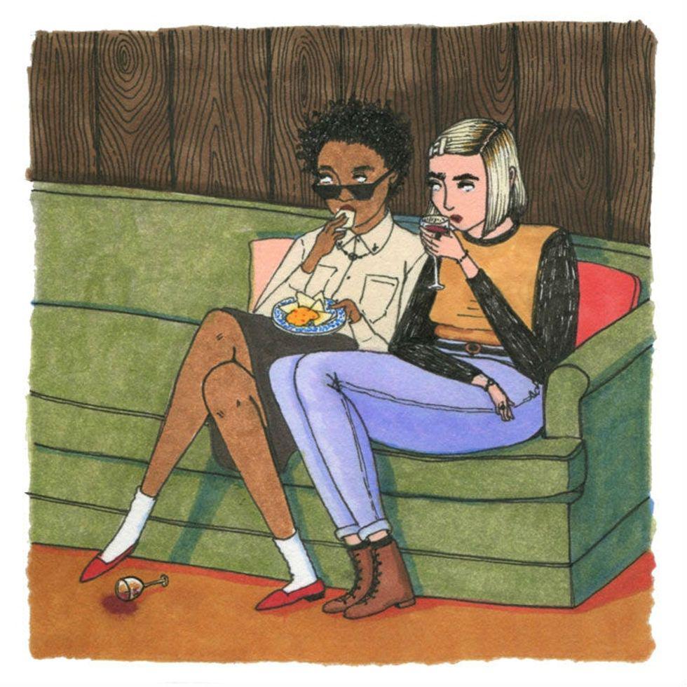 illustration of two women sitting together on a couch with wine and cheese