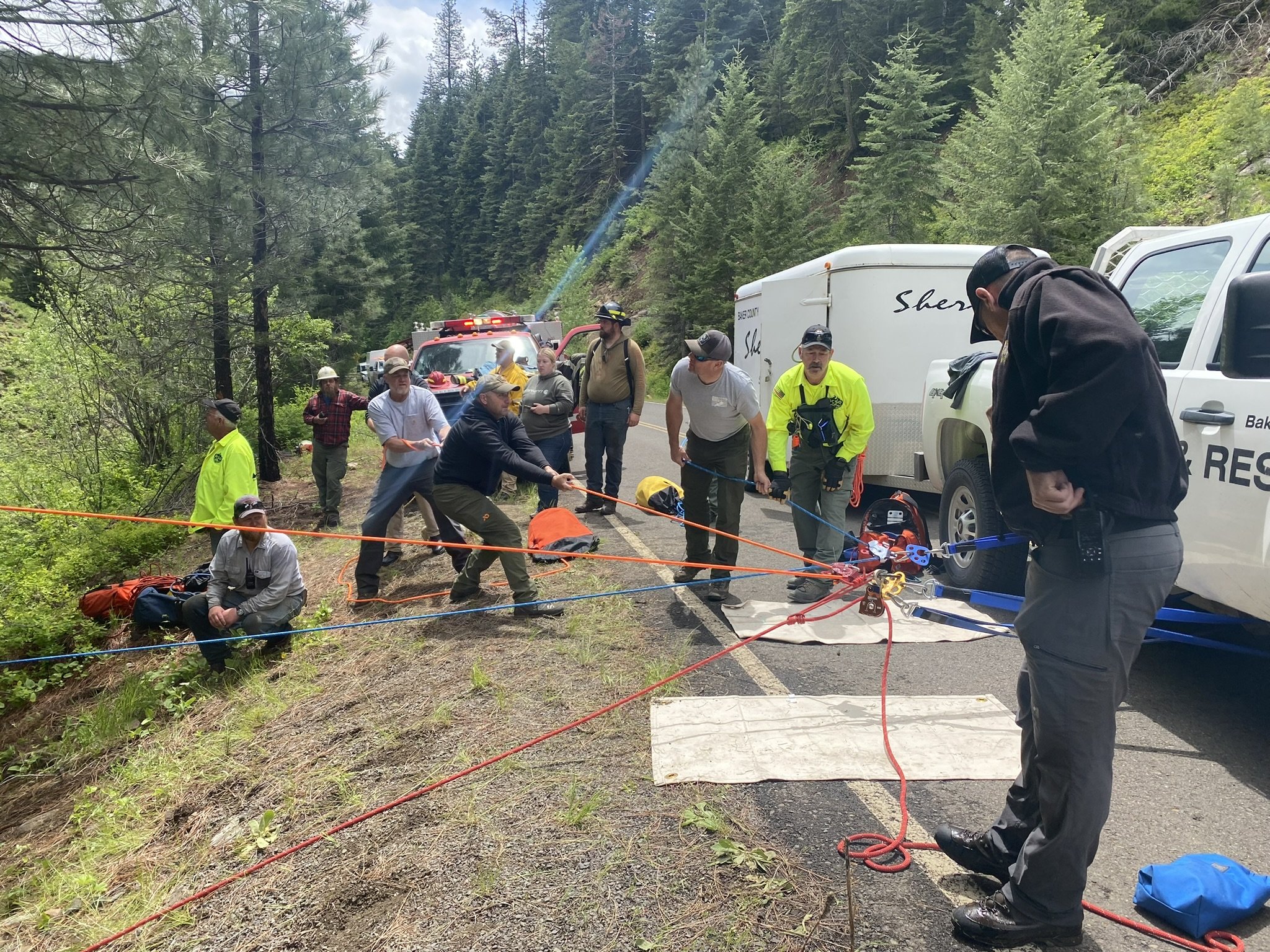 rescue team setting up highline rope system