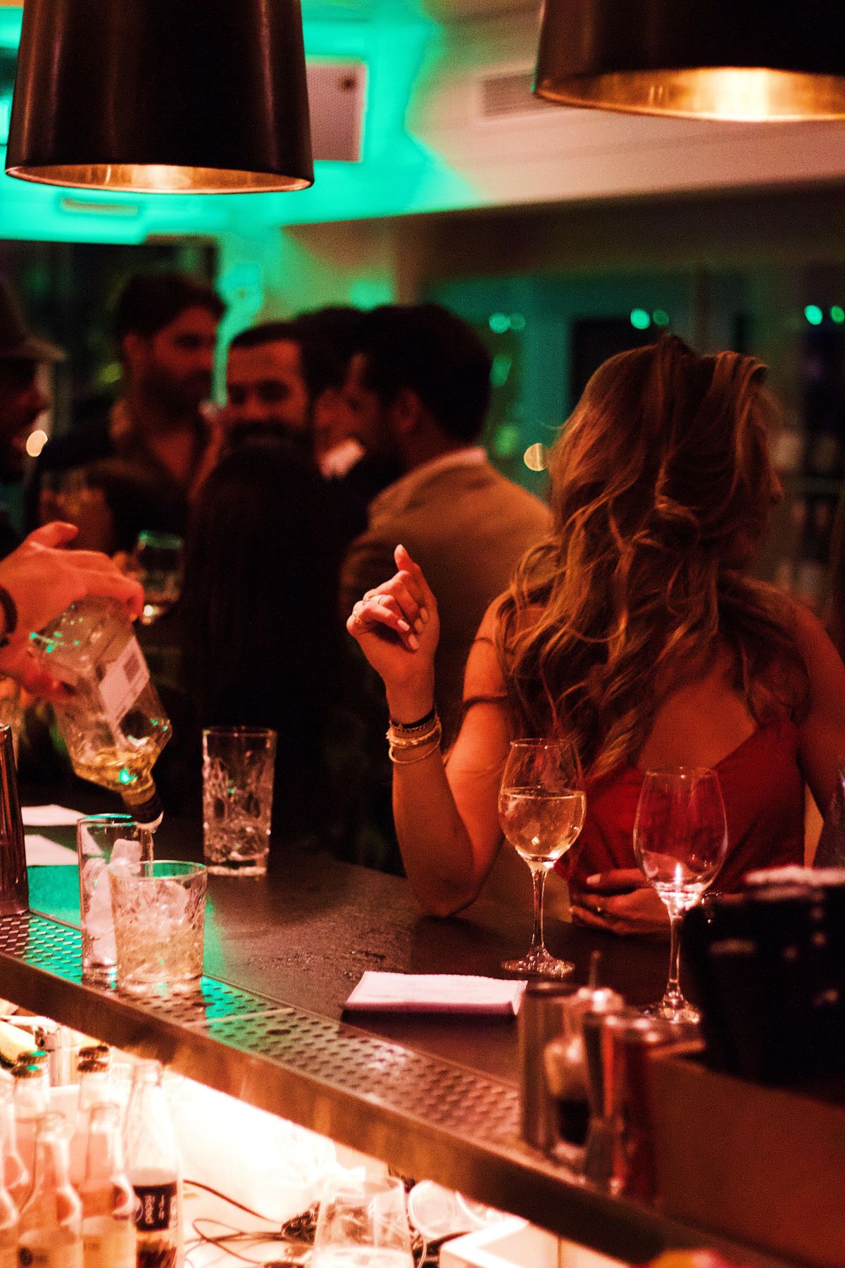 woman sitting in a crowded bar