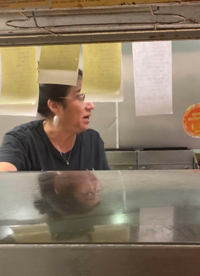 woman working in a restaurant kitchen