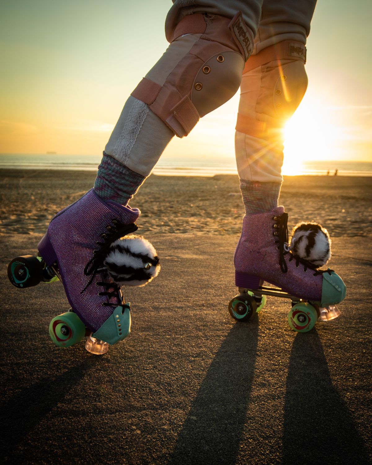 someone skating outside in pink roller skates