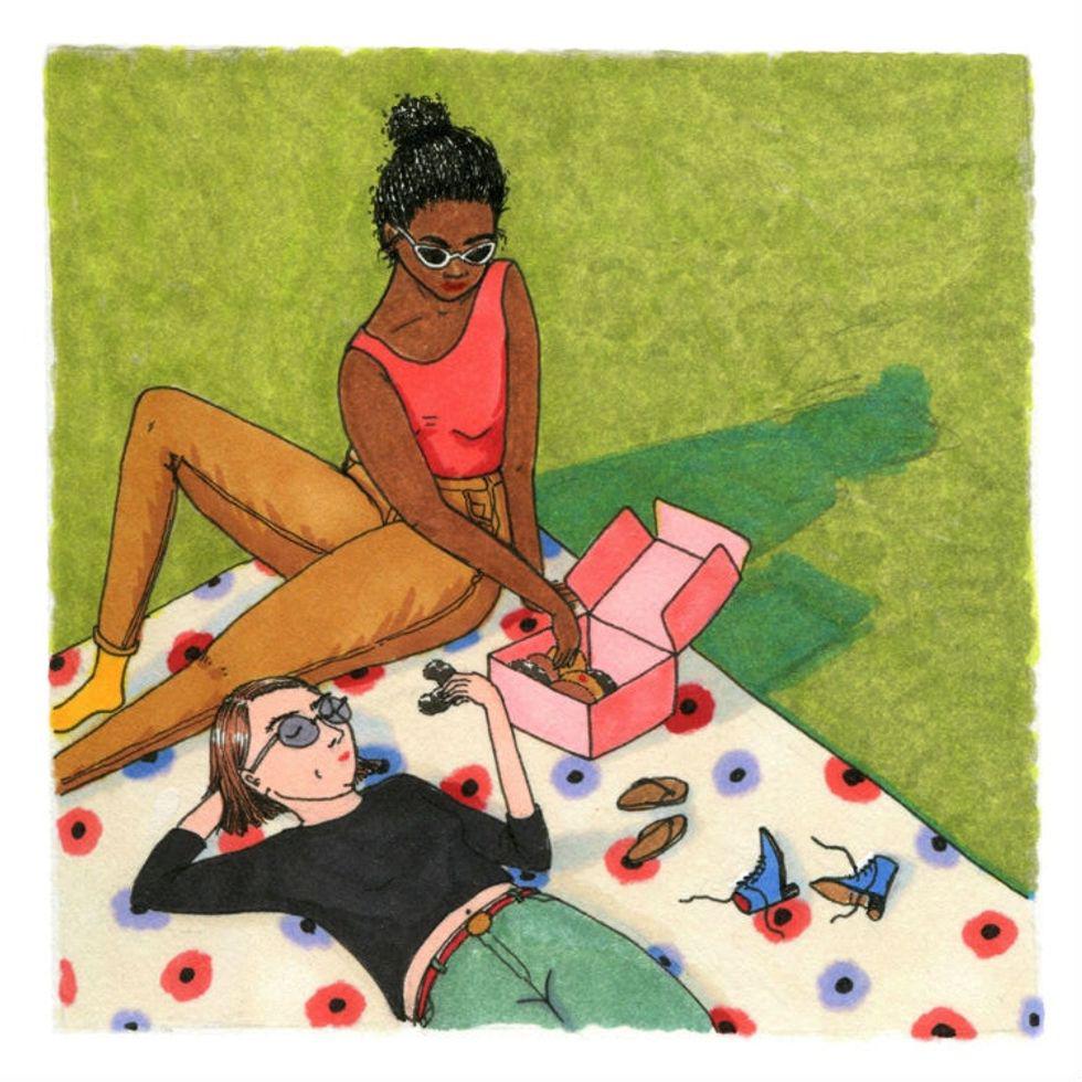 illustration of women relaxing on a blanket outside eating donuts