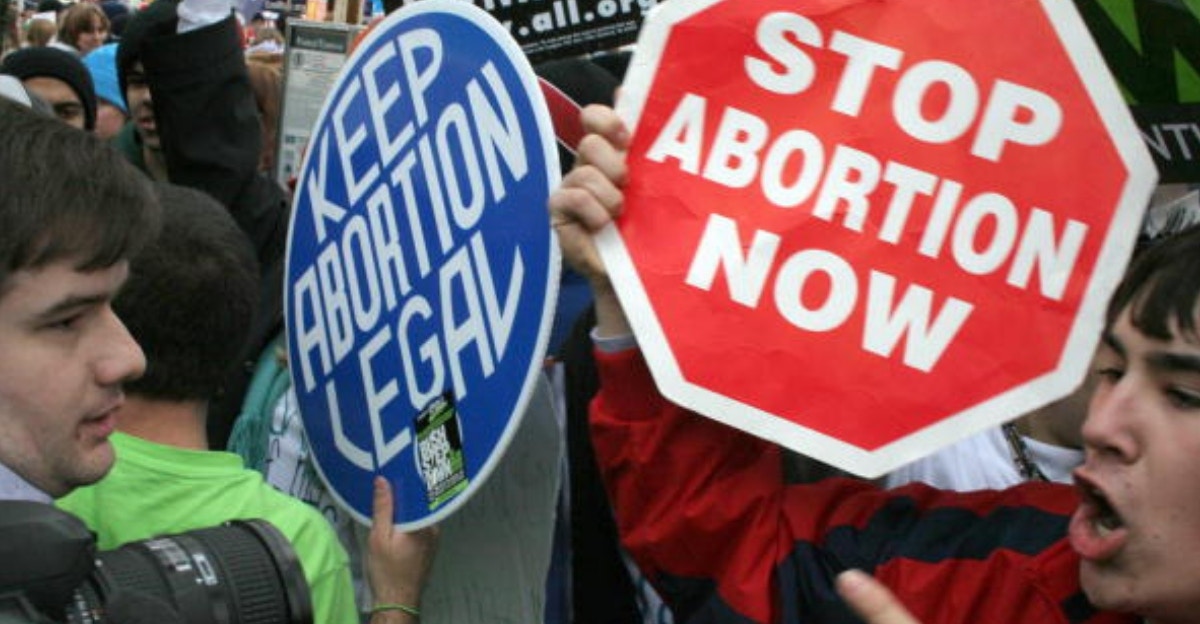 pro-life and pro-choice demonstrators face each other