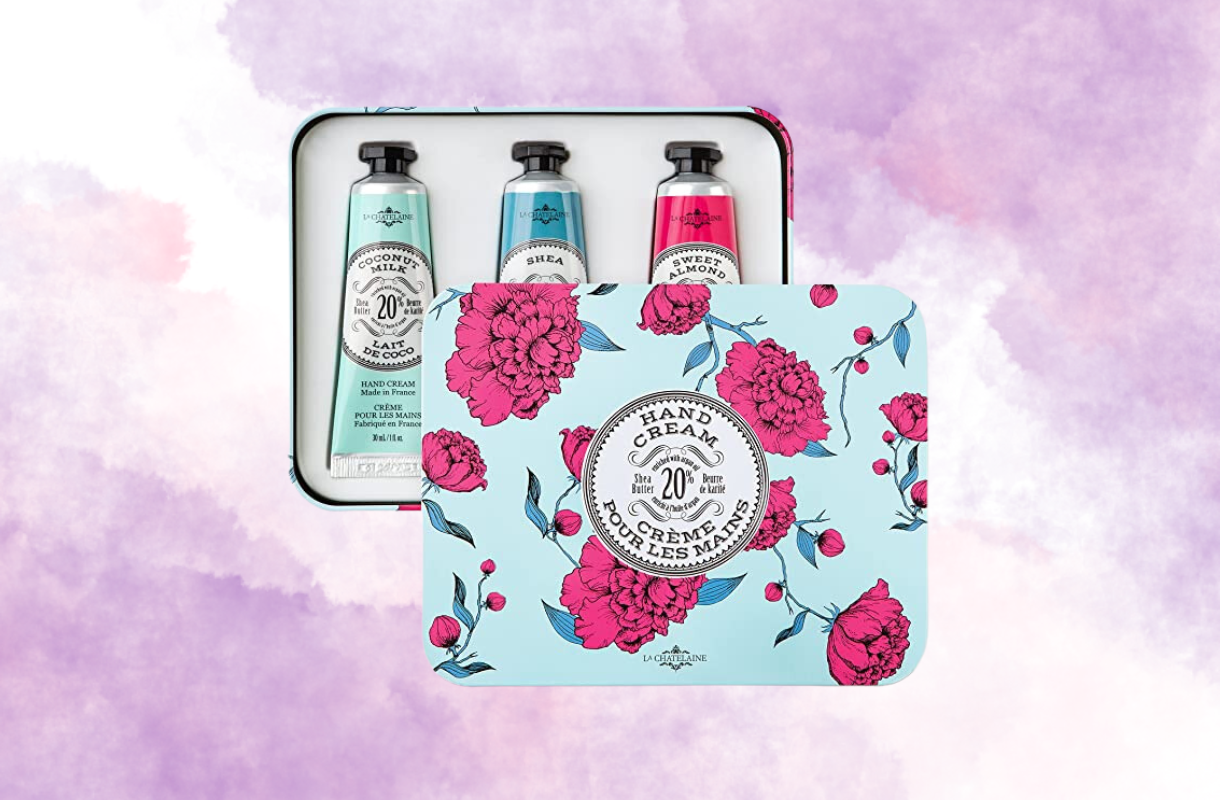 Floral hand cream gift set on a pastel purple background.