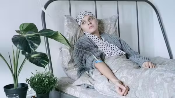 A terminally ill woman in her hospital bed.