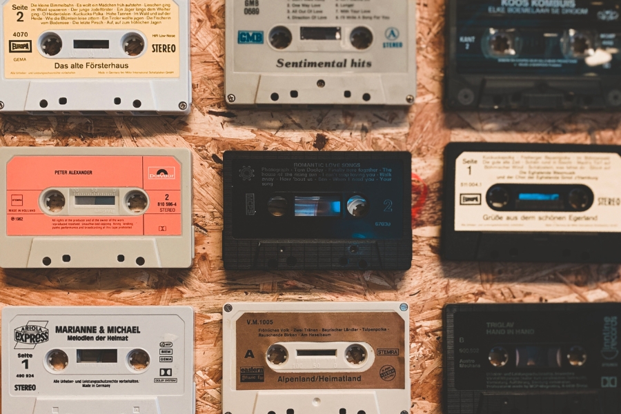 Cassette tapes from the 1980s neatly laid out on a table