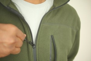 Man zipping a fleece sweatshirt