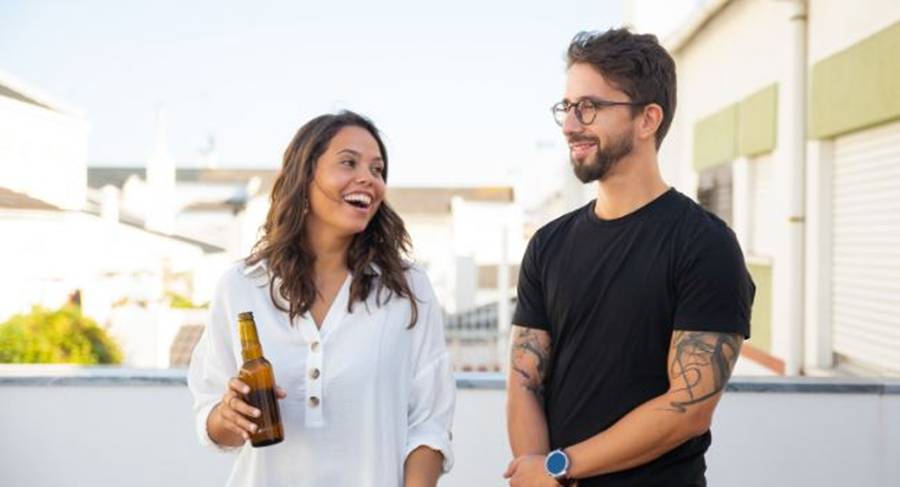 man and woman, chatting, beer, small talk, conversation, laughter