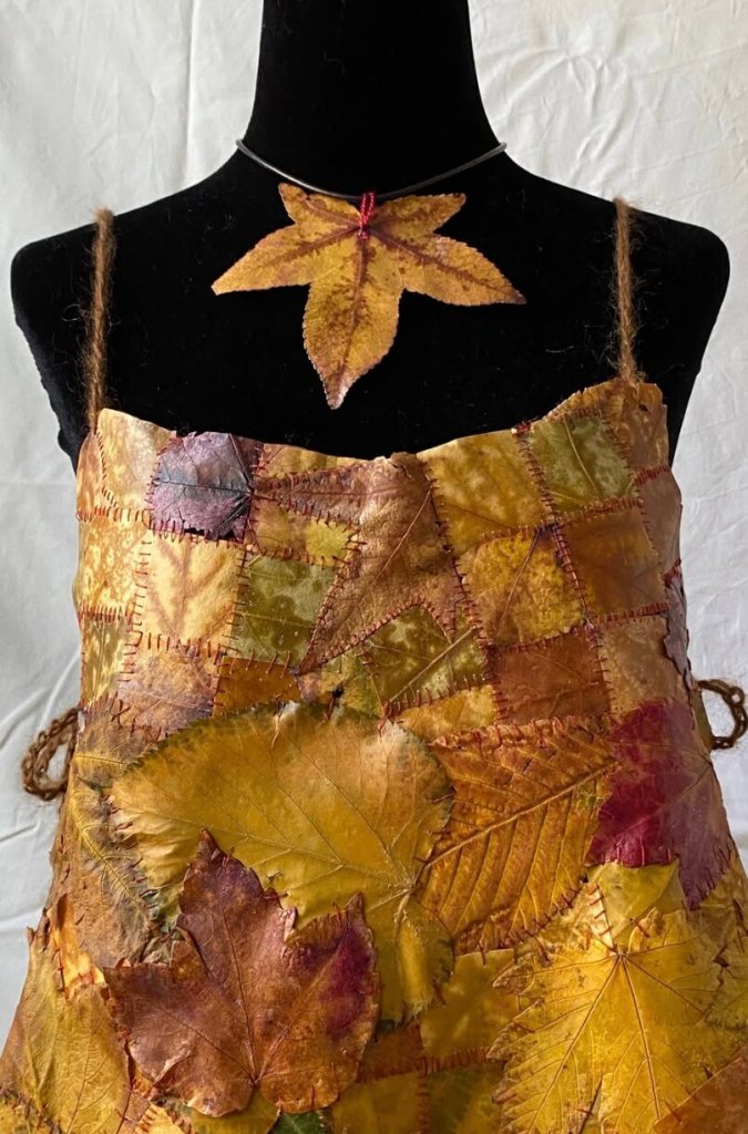 A dress sewn entirely out of preserved autumn leaves