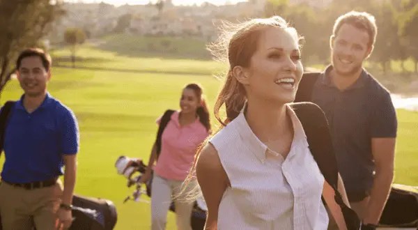 A group of people playing golf