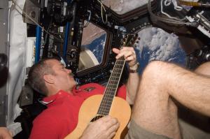 Canadian astronaut Chris Hadfield plays guitar from the International Space Station
