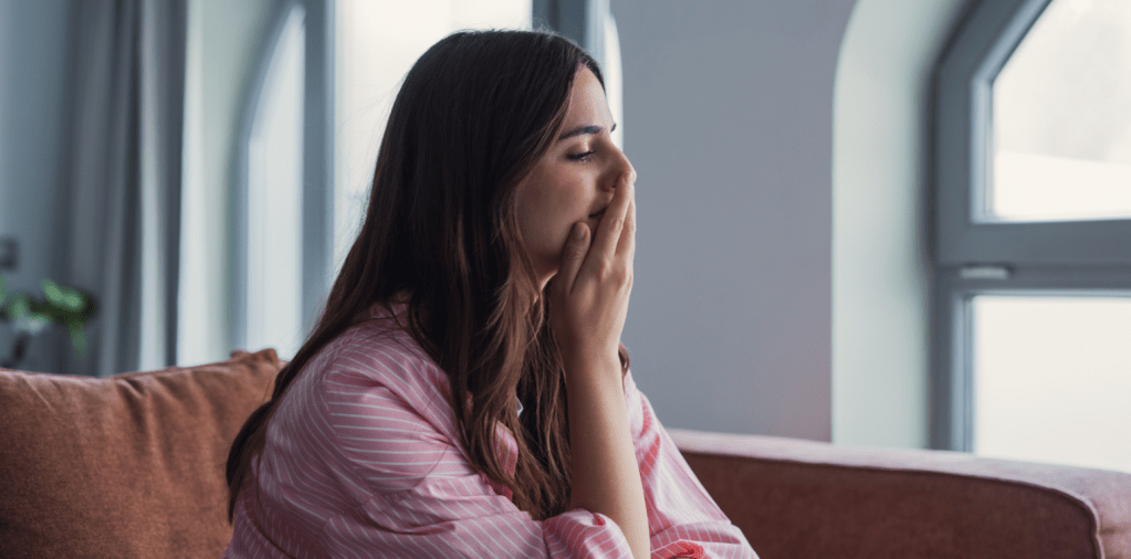 woman thinking, contemplation, young woman on couch, 