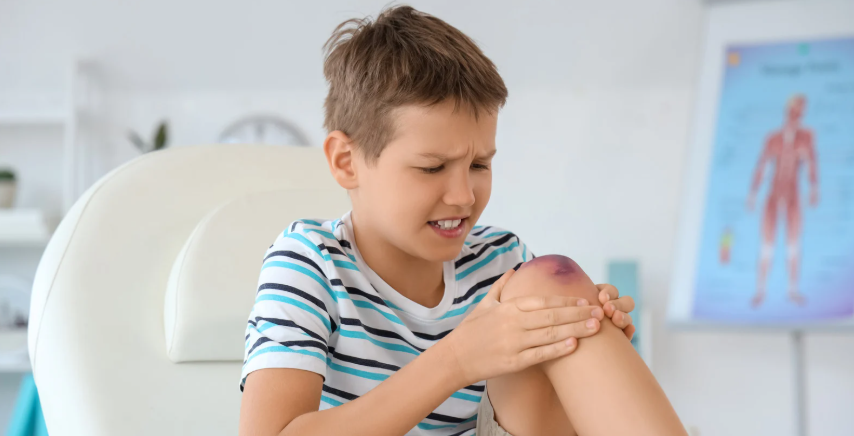 child hurt, hurt knee, doctor's office, kid in pain, young boy