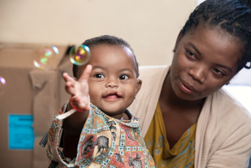 Marie, 11 months with her mother at Operation Smile Madagascar before her cleft surgery. 