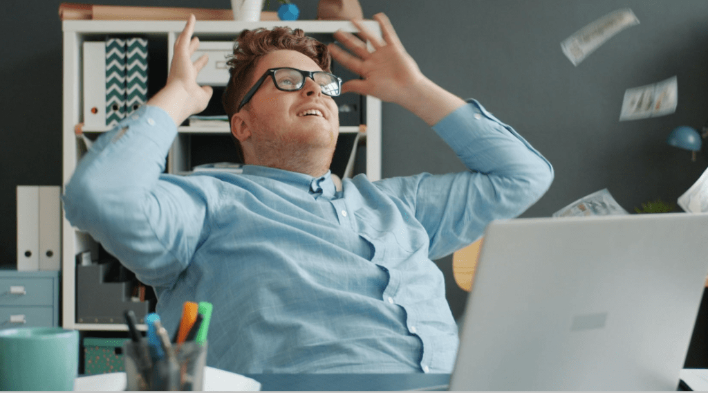 happy office worker, laptop, man with glasses, celebration, relief