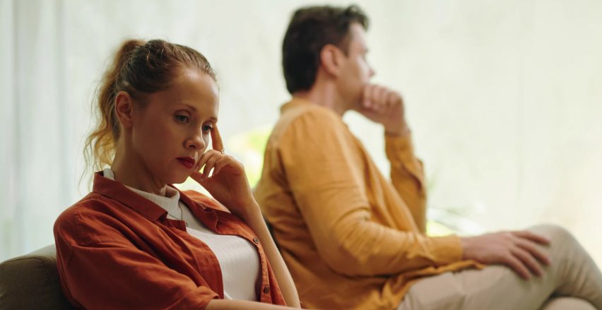 couple fight, couple arguing, upset couple, couple on couch, angry woman