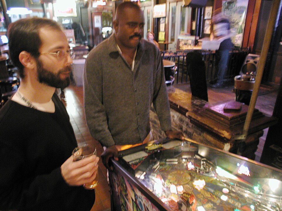 pinball, two men, bar, beard, mustache