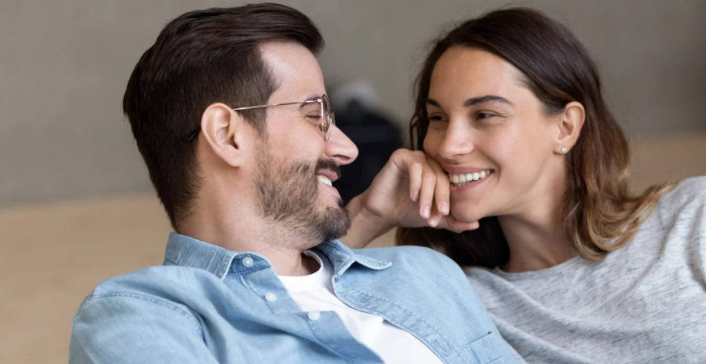 man and woman, people talking, eye contact, flirting, man in glasses
