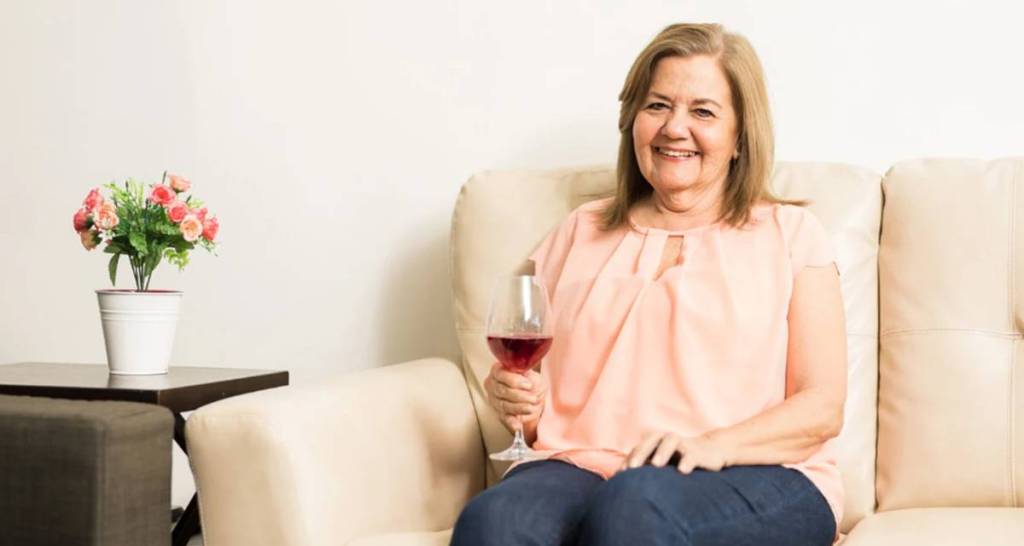 cocktail, mature woman drinking, wine, nursing home, woman on couch